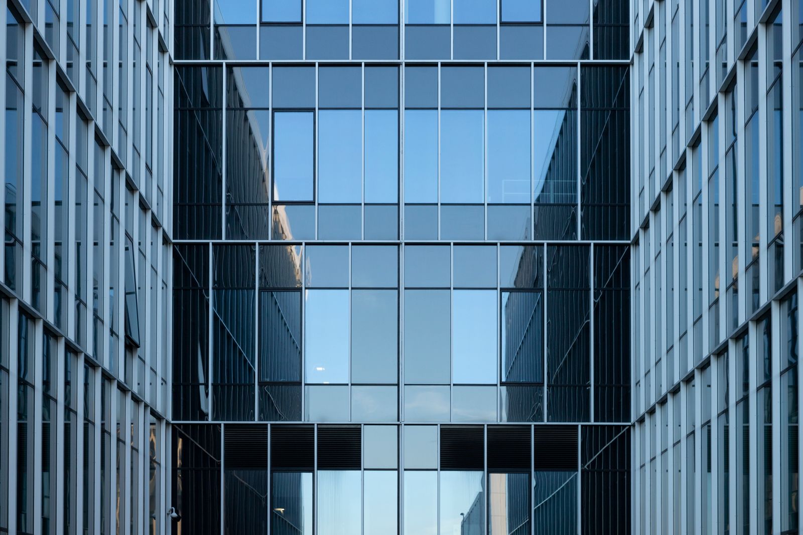 Reflective glass facade of a modern office building